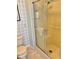 Bathroom featuring a standing shower with tiled walls and updated fixtures at 11 Navel Dr, Winter Haven, FL 33884
