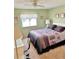 Well-lit bedroom featuring a desk and a cozy bed setup at 11 Navel Dr, Winter Haven, FL 33884