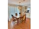 Formal dining area with hardwood floors, decorative lighting, and cabinet storage at 11 Navel Dr, Winter Haven, FL 33884