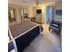 Comfortable main bedroom with mirrored closet doors and carpeted floors at 11 Navel Dr, Winter Haven, FL 33884