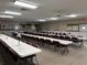 The community meeting and activities room with tables, chairs, and information boards at 11 Navel Dr, Winter Haven, FL 33884