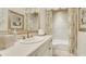 Charming bathroom with a vanity, framed mirror, decorative wallpaper, and a bathtub with shower at 1162 E Highland Dr, Lakeland, FL 33813