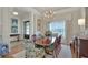Formal dining room with a chandelier, large window, and a spacious dining table at 1162 E Highland Dr, Lakeland, FL 33813