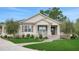 Charming home with a covered front porch, well-maintained lawn and beautiful landscaping at 1162 E Highland Dr, Lakeland, FL 33813