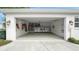 Spacious three-car garage with ample storage, well lit with sealed concrete floors at 1162 E Highland Dr, Lakeland, FL 33813