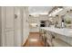 Bright, updated kitchen featuring stainless steel appliances and custom white cabinetry at 1162 E Highland Dr, Lakeland, FL 33813