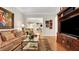 Comfortable living room with decorative molding and an opening to the dining area at 1162 E Highland Dr, Lakeland, FL 33813