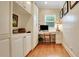 Bright home office featuring custom built-ins, a spacious desk, and natural light at 1162 E Highland Dr, Lakeland, FL 33813