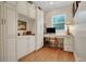 Home office featuring custom built-ins and hardwood flooring at 1162 E Highland Dr, Lakeland, FL 33813
