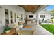 Outdoor patio with comfortable lounge seating, dining area, and outdoor entertainment setup at 1162 E Highland Dr, Lakeland, FL 33813