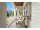 Inviting porch with wicker chairs, offering a relaxing outdoor seating area at 1162 E Highland Dr, Lakeland, FL 33813