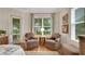 Inviting sitting area in the main bedroom with comfortable chairs and tranquil outdoor views at 1162 E Highland Dr, Lakeland, FL 33813