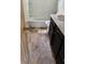 Bathroom featuring a tub and shower combo, a toilet, and a dark vanity with a light countertop at 128 11Th Wahneta W St, Winter Haven, FL 33880
