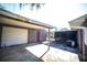 View of detached garage, backyard, and screened-in lanai at 1432 Libby Rd, Babson Park, FL 33827