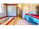 Bright bathroom with a separate tub, vanity, tile floor, and a doorway to a walk-in closet at 1432 Libby Rd, Babson Park, FL 33827