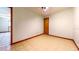 Bedroom featuring tile floors, a neutral paint scheme, and a paneled wood door at 1432 Libby Rd, Babson Park, FL 33827