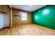 Bright bedroom featuring hardwood floors, neutral-tone walls, and a window providing natural light at 1432 Libby Rd, Babson Park, FL 33827