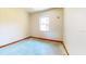 Small bedroom featuring hardwood trim and a single window at 1432 Libby Rd, Babson Park, FL 33827