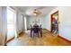 Bright dining room with hardwood floors, a modern chandelier, and large windows that let in plenty of natural light at 1432 Libby Rd, Babson Park, FL 33827
