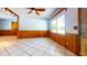 Inviting living room features tile floors, wood accents, large window and natural light at 1432 Libby Rd, Babson Park, FL 33827