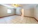 Spacious living room featuring tile floors and a ceiling fan at 1432 Libby Rd, Babson Park, FL 33827