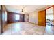 Living room featuring tile floors, a ceiling fan, and neutral paint scheme at 1432 Libby Rd, Babson Park, FL 33827