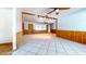 Spacious living area with tile flooring, wood paneling and ample natural light at 1432 Libby Rd, Babson Park, FL 33827