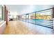 Enclosed sunroom with tile floors offers great views of the backyard swimming pool at 1432 Libby Rd, Babson Park, FL 33827