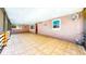 Bright sunroom with neutral-tone tiles, screen windows, and access to backyard at 1432 Libby Rd, Babson Park, FL 33827