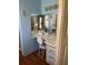 Elegant bathroom vanity with mirrored wall area and stylish decor at 148 Sweet Cir, Winter Haven, FL 33884