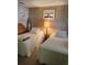 Charming bedroom featuring twin beds, side table, and cozy decor at 148 Sweet Cir, Winter Haven, FL 33884