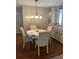 Cozy dining area with a dining table set for four, cabinetry with storage at 148 Sweet Cir, Winter Haven, FL 33884