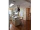 Spacious kitchen featuring an island with seating, wood-look flooring, and plenty of natural light at 148 Sweet Cir, Winter Haven, FL 33884