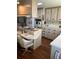 Bright kitchen with ample storage space, an island with seating, and lots of counter space at 148 Sweet Cir, Winter Haven, FL 33884