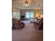 Cozy living room with comfortable armchairs and a large window for natural light at 148 Sweet Cir, Winter Haven, FL 33884