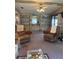 Inviting living room featuring built-in shelving, comfortable seating, and ample natural light at 148 Sweet Cir, Winter Haven, FL 33884