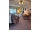 Comfortable living room with nautical decor and large windows that flood the space with natural light at 148 Sweet Cir, Winter Haven, FL 33884