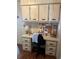 Functional office area with built-in desk, cabinets, and drawers, offering organized workspace at 148 Sweet Cir, Winter Haven, FL 33884