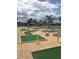 Well-maintained putting green offers a fun recreational activity for residents at 148 Sweet Cir, Winter Haven, FL 33884