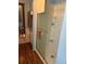 Clean, well-lit shower with glass door, tile accents, and modern fixtures at 148 Sweet Cir, Winter Haven, FL 33884
