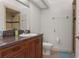 Full bathroom features granite vanity top, sink, toilet and shower at 1503 Eagle Pond Dr # 1503, Winter Haven, FL 33884