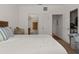 Comfortable bedroom includes views to a full bathroom and walk-in closet at 1503 Eagle Pond Dr # 1503, Winter Haven, FL 33884