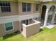 Two-story condo with neutral paint scheme, stairs to upper units, and small patio area at 1503 Eagle Pond Dr # 1503, Winter Haven, FL 33884