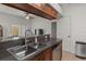 The kitchen features granite countertops, a stainless sink and modern appliances at 1503 Eagle Pond Dr # 1503, Winter Haven, FL 33884
