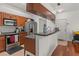 Kitchen features stainless appliances, granite counters, and wood accents at 1503 Eagle Pond Dr # 1503, Winter Haven, FL 33884