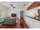 Open living space features hardwood floors, ceiling fan and outdoor access at 1503 Eagle Pond Dr # 1503, Winter Haven, FL 33884