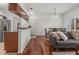 Open living area with hardwood floors, modern furnishings, and seamless connection to the dining space, ideal for entertaining at 1503 Eagle Pond Dr # 1503, Winter Haven, FL 33884