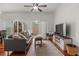Stylish living room with sliding doors, hardwood floors, comfy seating, and modern decor, offering comfort at 1503 Eagle Pond Dr # 1503, Winter Haven, FL 33884