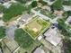 Property highlighted by a white border with mature trees surrounding it at 1506 Chamberlain Loop, Lake Wales, FL 33853