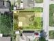 Aerial view of the property with a well-maintained yard and mature trees at 1506 Chamberlain Loop, Lake Wales, FL 33853